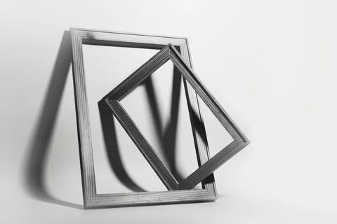 Studio image of two wooden frames on white background. Stock Photos