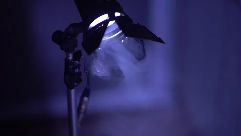 Studio lamp on the blue background Stock Footage 77558576