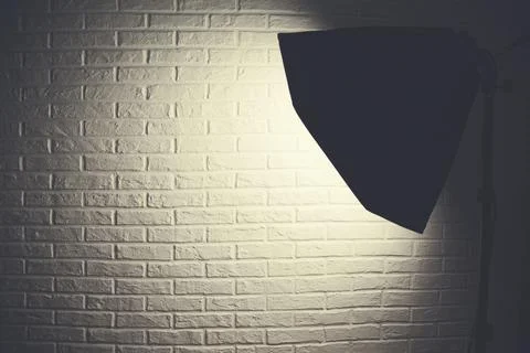 Studio light  on Brick wall background Stock Photos