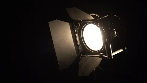 Studio light turns on in the dark Stock Footage 100239957