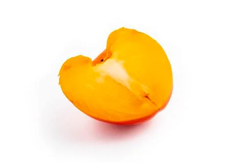 Studio lighting. persimmon fruit on a white background. There is a shadow. Cl Stock Photos