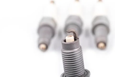 Studio lighting. spark plug from a gasoline engine. It is matte. Close-up. Stock Photos