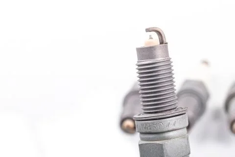 Studio lighting. spark plug from a gasoline engine. It is matte. Close-up. Stock Photos