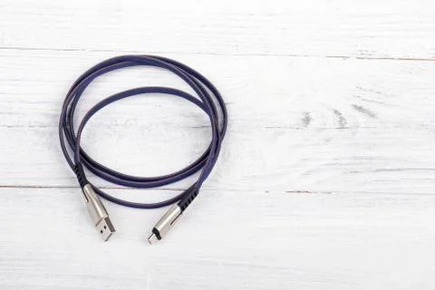 Studio lighting. usb wire for connecting to a computer in blue or purple on a Stock Photos