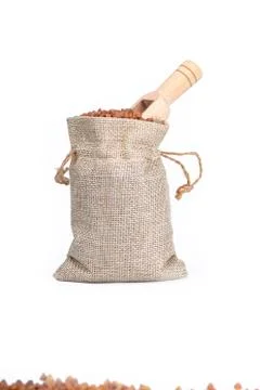 Studio lighting. on a white background, not a large bag of flax, buckwheat is Stock Photos