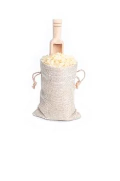 Studio lighting. on a white background. Not a big bag of rice. Wooden spice s Stock Photos