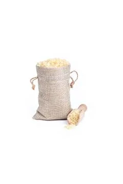 Studio lighting. on a white background. Not a big bag of rice. Wooden spice s Stock Photos