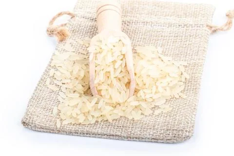 Studio lighting. on a white background. Not a big bag of rice. Wooden spice s Stock Photos