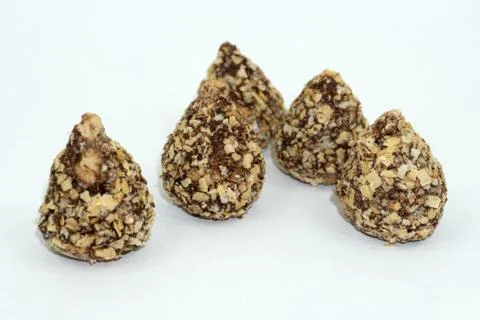 Studio macro of assorted delicious liqueur chocolates on a white background w Stock Photos
