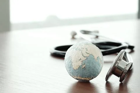 Studio macro of a stethoscope and texture globe with shallow DOF evenly mat.. Stock Photos