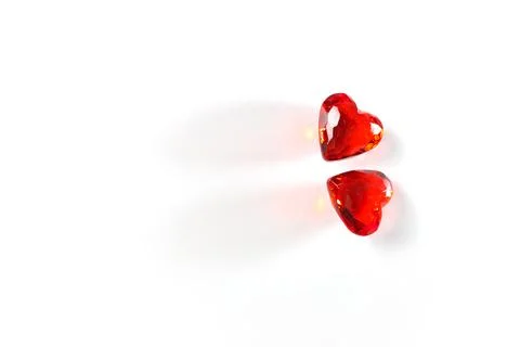 Studio mage of Two Sparkling Red Gemstone Hearts on a White Studio Background Stock Photos