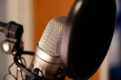 A studio microphone with black filter in close up Stock Photos