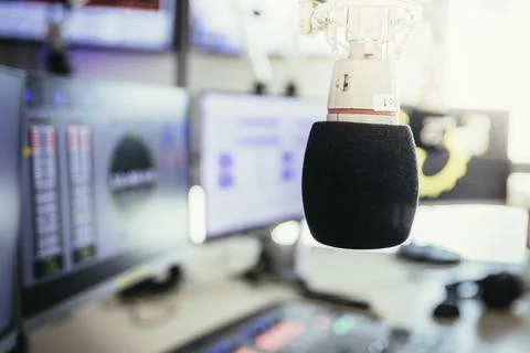 Studio microphone in a broadcasting radio studio, mixer and computer in the Stock Photos