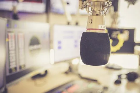 Studio microphone in a broadcasting radio studio, mixer and computer in the Stock Photos