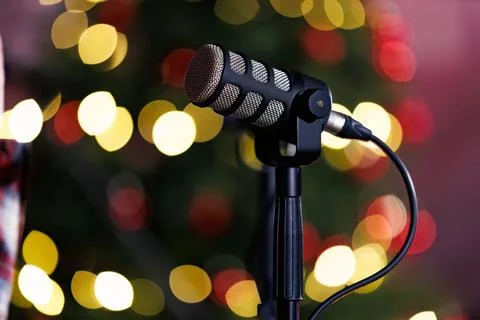 Studio microphone with festive bokeh lights background. Stock Photos