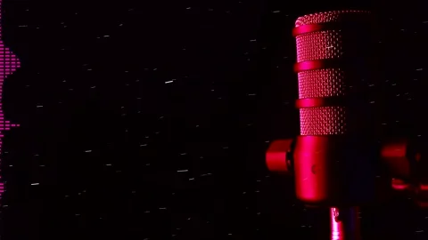 A studio microphone with glowing equalizer bands on a dark background for Stock Footage 327024341