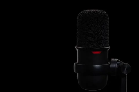 Studio microphone, isolated on black. copy space on left Stock Photos