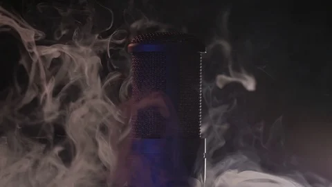 A studio microphone is sorrounded by a thick white smoke. Stock Footage 116136626