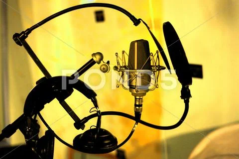 Studio microphone in yellow room Stock Photos