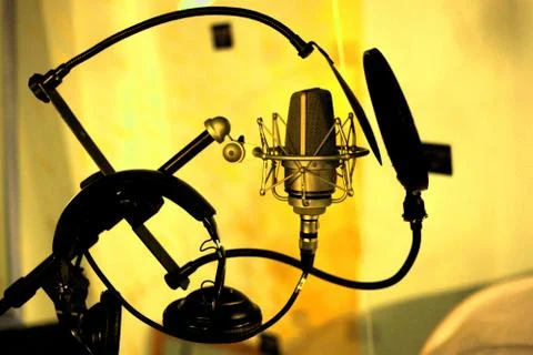 Studio microphone in yellow room Stock Photos