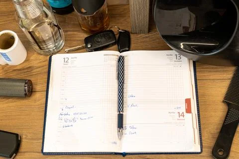 In a studio, the notebook with the appointments of a professional barber was Stock Photos