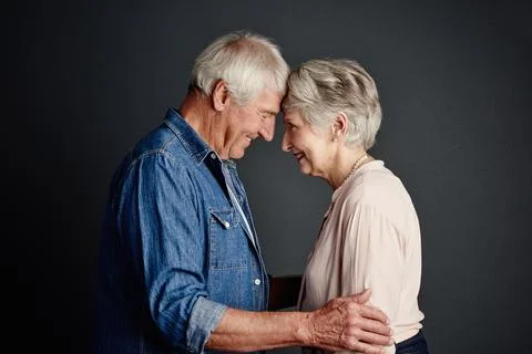 Studio, old couple and bonding with smile, affection and commitment for mar.. Stock Photos