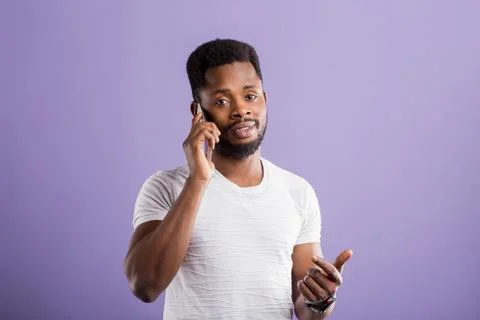 Studio portrait of american man posing with smartphone Foto stock