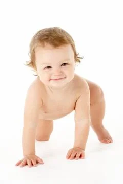 Studio Portrait Of Baby Boy Crawling Stock Photos
