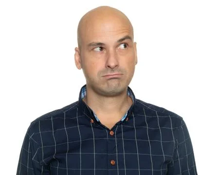 Studio portrait of a bald guy is thinking looking up Stock Photos