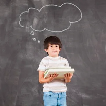 Studio portrait of boy (6-7) with thought bubble Stock Photos