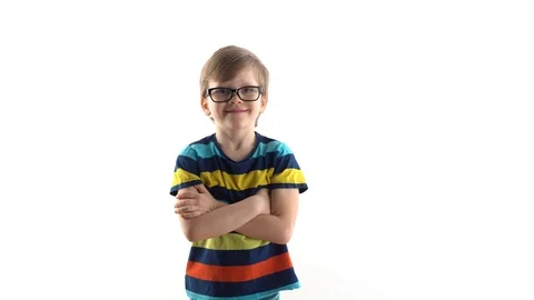Studio portrait of a boy on a white background. first grader with glasses Stock Footage 125851378