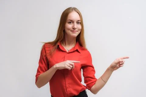 Studio portrait on the camera of a smiling beautiful girl with long hair talk Stock Photos