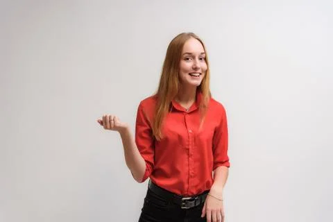 Studio portrait on the camera of a smiling beautiful girl with long hair talk Stock Photos