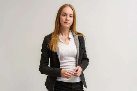 Studio portrait on the camera of a smiling beautiful girl with long hair talk Stock Photos