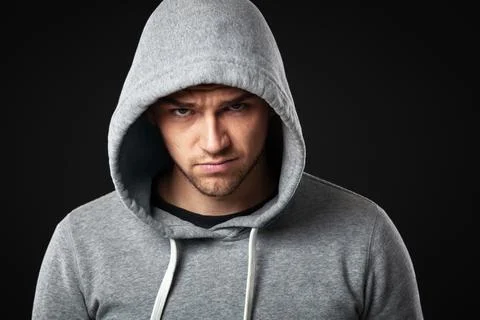 Studio portrait of cool looking young guy in sportswear. Stock Photos