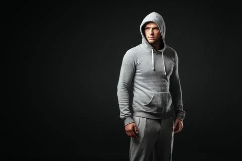 Studio portrait of cool looking young guy in sportswear. Stock Photos