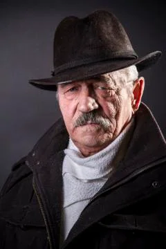 Studio portrait of an expressive old man 写真素材