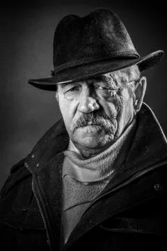 Studio portrait of an expressive old man 写真素材