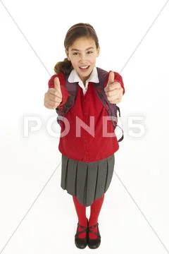 Studio Portrait Of Female Student In Uniform With Backpack Stock Photos