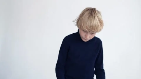 Studio portrait. Funny blond child with long hair. In room Stock Footage 165385015