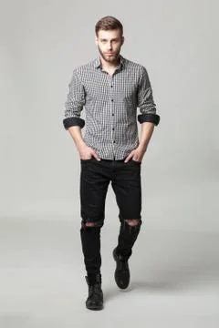 Studio portrait of handsome elegant young man in casual clothes posing. Foto stock