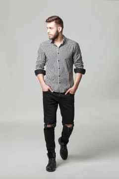 Studio portrait of handsome elegant young man in casual clothes posing. Stock Photos