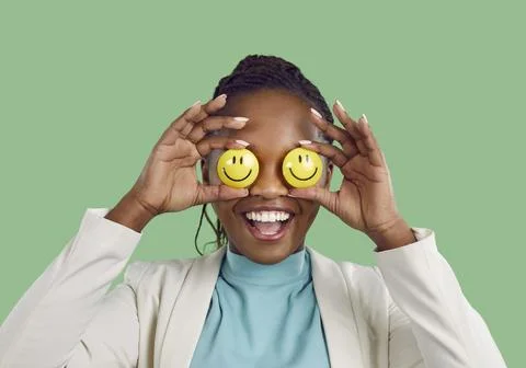 Studio portrait of a happy positive optimistic African American lady with eyes Stock Photos