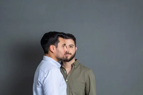 Studio portrait of hispanic man facing caucasian man Stock Photos