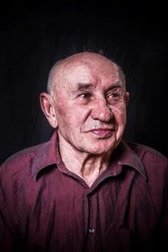 Studio portrait of laughing old man 写真素材