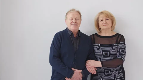 Studio portrait of middle-aged man and woman looking at camera. Stock Footage 272791290