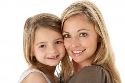Studio Portrait Of Mother Hugging Young Daughter Stock Photos