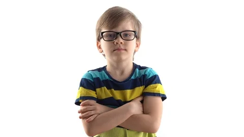 Studio portrait of a serious boy on a white background. first grader with Stock Footage 124457715