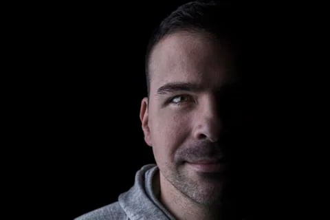 Studio portrait of a serious man looking at the camera. Stock Photos