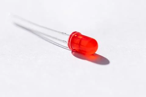 A studio portrait of a single red colored LED or color Light Emitting Diode l Stock Photos
